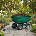 Garden dumping cart loaded with soil and plants in use